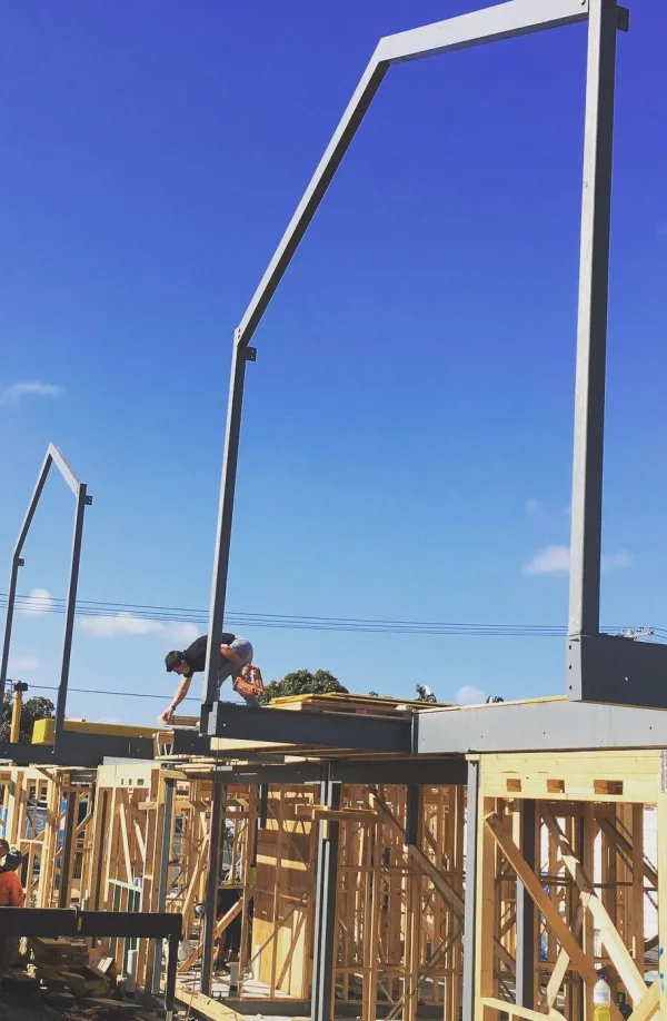 Structural steel portal frame on a timber frame build
